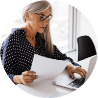 A woman sorting through papers